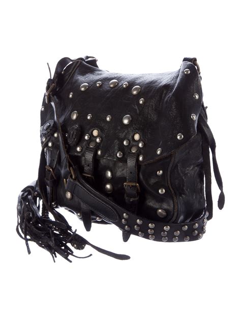 large black studded crossbody bag.